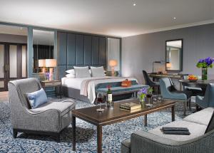 a hotel room with a bed and a living room at The Hardiman in Galway