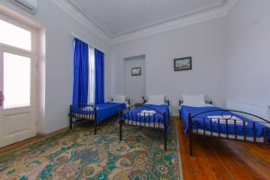 Postel nebo postele na pokoji v ubytování House 1899