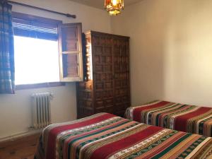 Postel nebo postele na pokoji v ubytování Hostal Rural Poqueira