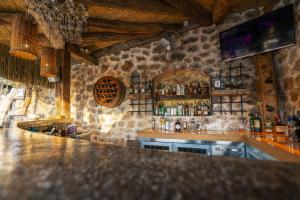 a bar with a counter with bottles of alcohol at Hotel Unique-Boutique Class - Adults Only in Fethiye
