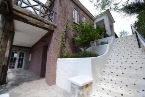 a white bench sitting on the side of a building at Hotel Unique-Boutique Class - Adults Only in Fethiye