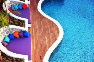 an overhead view of a pool with chairs and a swimming pool at Hotel Unique-Boutique Class - Adults Only in Fethiye
