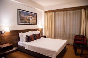 Postel nebo postele na pokoji v ubytování Lemon Tree Hotel, Thimphu