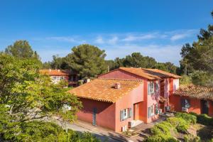 a group of houses with trees in the background at SOWELL RESIDENCES Chênes Verts in Saint-Raphaël
