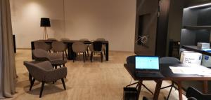 A television and/or entertainment centre at Downtown Vienna new built luxury suites