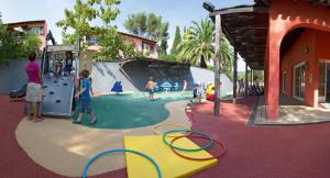 a group of children playing in a playground at SOWELL RESIDENCES Chênes Verts in Saint-Raphaël