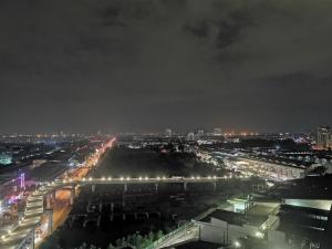 a view of a city at night with lights at Da Men Subang Jaya USJ by Iconique in Subang Jaya