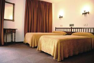 Postel nebo postele na pokoji v ubytování Hotel Folch