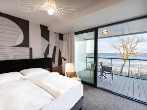 Posteľ alebo postele v izbe v ubytovaní VacationClub – Seaside Apartament 410