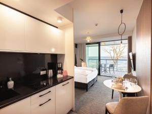 Posteľ alebo postele v izbe v ubytovaní VacationClub – Seaside Apartament 410