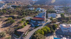 an aerial view of a town with mountains in the background at Lindian Jewel Hotel and Villas in Líndos