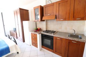 Køkken eller tekøkken på Casa vacanze Frida in Salento + 25 billeder