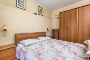 Postel nebo postele na pokoji v ubytování Apartments Rina