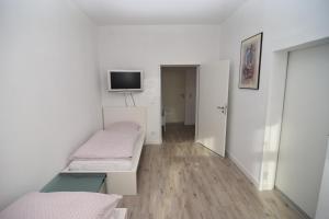 Postel nebo postele na pokoji v ubytování City Apartment Vohwinkel