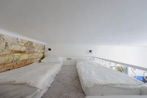Posteľ alebo postele v izbe v ubytovaní Pinkova Apartments