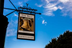 a sign for the bell pub with rooms at The Bell - Brunning and Price in Alderminster