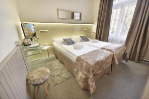 Postel nebo postele na pokoji v ubytování Anette Hotel