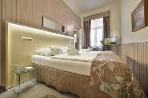 Postel nebo postele na pokoji v ubytování Anette Hotel