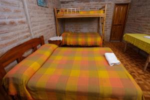 Voodi või voodid majutusasutuse Estancia, CABAÑAS INTAG toas