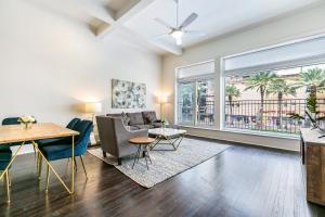 a living room with a couch and a table at 1 and 2 BR Private Condos Steps Away From French Quarter in New Orleans
