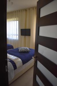 Postel nebo postele na pokoji v ubytování Ta Gangu