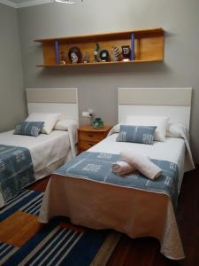 Łóżko lub łóżka w pokoju w obiekcie Apartamento La Real