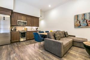 a living room with a couch and a table at 1 and 2 BR Private Condos Steps Away From French Quarter in New Orleans