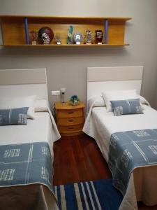 Łóżko lub łóżka w pokoju w obiekcie Apartamento La Real