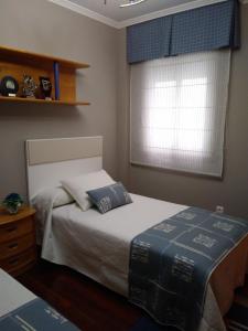 Łóżko lub łóżka w pokoju w obiekcie Apartamento La Real