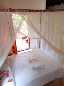 Postel nebo postele na pokoji v ubytování Trancoso, Bahia - Casa por temporada com estacionamento