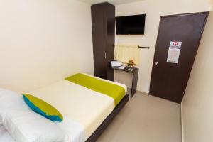 Postel nebo postele na pokoji v ubytování Azuán Suites Hotel By GEH Suites