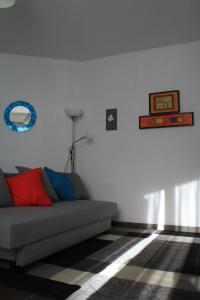a living room with a couch and a rug at TataBlu residenza con parcheggio in Florence