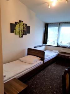 Posteľ alebo postele v izbe v ubytovaní Motel Orion Wolsztyn