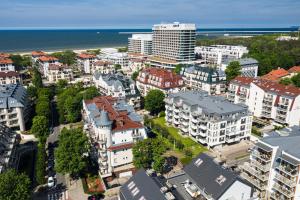 an aerial view of a city with buildings and the ocean at Apartamenty Promenada - visitopl in Świnoujście