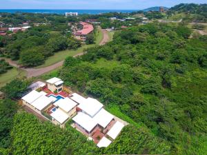 an aerial view of a house on a hill at Tamarindo Garden Boutique Homes in Tamarindo