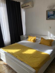 A bed or beds in a room at Sunny Varshava Hotel