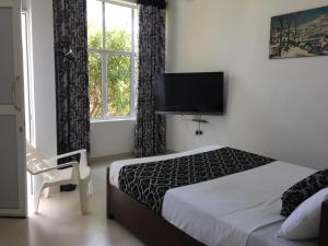 Letto o letti in una camera di RoaBaa Guesthouse