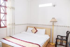 Postel nebo postele na pokoji v ubytování Tigon Flower House