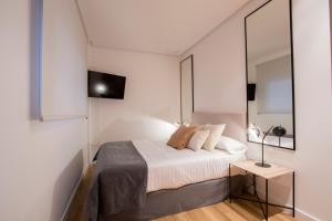 Llit o llits en una habitació de Flatsforyou San Vicente