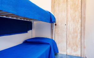A bed or beds in a room at Luxury Apartments - Torre San Giovanni