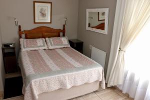 Ένα ή περισσότερα κρεβάτια σε δωμάτιο στο Lakeview Cottages