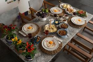 a table with plates of food on top of it at Valentina Boutique Hotel in Bozburun