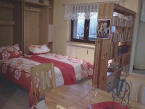 a bedroom with two beds and a table and a table at Appartement Moselblick in Cochem