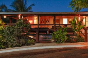 an exterior view of a house at night at Pousada Mar Atlântico in Fernando de Noronha