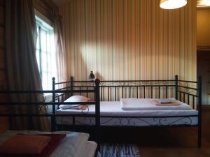 Postel nebo postele na pokoji v ubytování Senosios Gegužinės ūkis