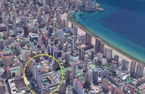 an aerial view of a city with a yellow circle at Apartamento Carmenchu Gemelos 20 in Benidorm