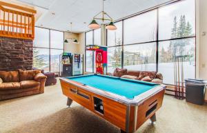 a living room with a pool table in it at Lodgepole Condos in Silverthorne