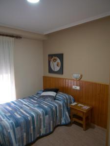 Postel nebo postele na pokoji v ubytování Hostal Durá