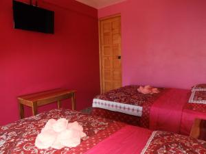 Een bed of bedden in een kamer bij Hotel Adulam