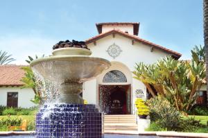 
a water fountain in front of a swimming pool at Omni La Costa Resort & Spa in Carlsbad
